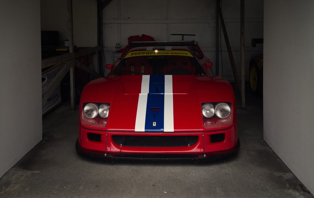 Red sports car parked in a garage